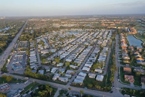 Aerial view showcasing the grid-like pattern of a residential neighborhood in Fort Myers, Florida.