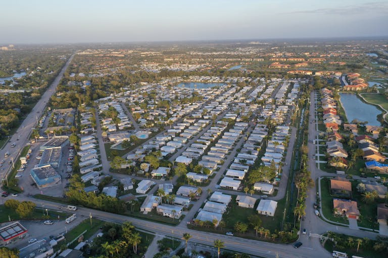 Aerial view showcasing the grid-like pattern of a residential neighborhood in Fort Myers, Florida.